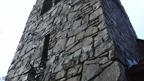 Low angle view of an old stone church bell tower Stock Footage 341907700