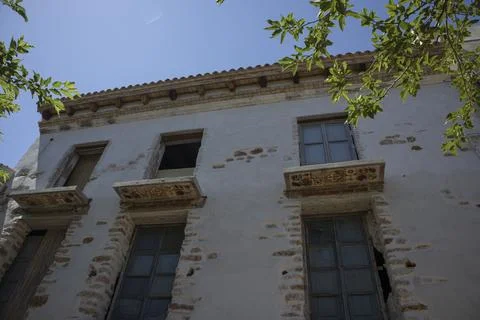 Low angle view of old traditional Spanish building facade with vintage balc.. Stock Photos