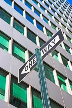Low angle view of One Way sign Stock Photos