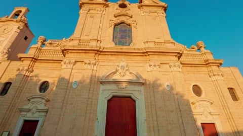 Low angle view of Oria Cathedral facade against blue sky Stock Footage 315491884