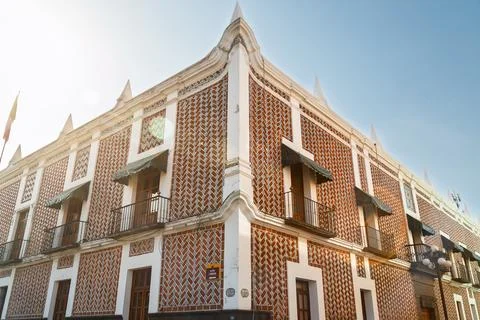 Low angle view of ornate corner facade of Former Federal Palace covered in tradi Stock Photos