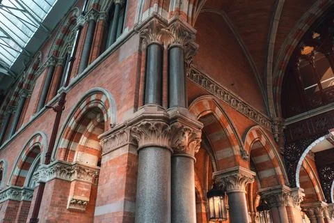 A low angle view of the ornate interior of a train station in London, UK. The Stock Photos