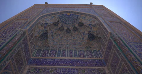Low angle view of ornate mosaic iwan ceiling and historic Islamic facade Stock Footage 332432875