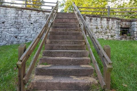 Low angle view up outdoor stone staircase in colonial American village Stock Photos