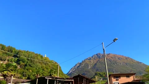 Low Angle View over City of Porlezza and Mountain in a Sunny Day Stockbeeldmateriaal 191952567