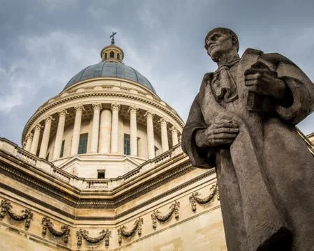 Low angle view of the Pantheon under a cloudy sky at daytime in Paris in Fran Stock Photos
