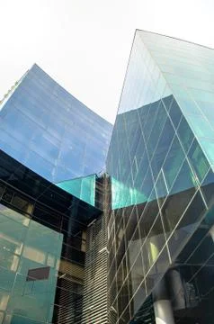 Low angle view of part of modern corporate building from glass with colorful Stock Photos