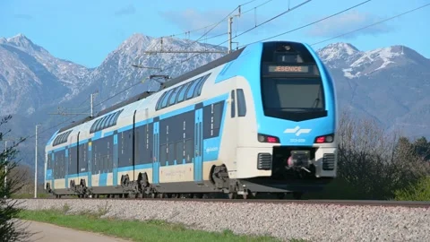 Low angle view of passenger train passing by Stock Footage 192504843