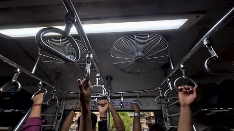 Low angle view of passengers standing inside a crowded local train carriage Stock Footage 336705005
