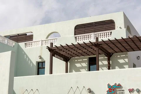 Low angle view of pastel coloured mediterranean style building. Stock Photos