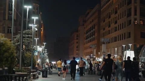 Low angle view of people walking in street in the night in Armenia, Yerevan Stock Footage 156648158