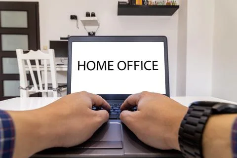 Low angle view of a person typing on a laptop. Stay home concept. Stock Photos