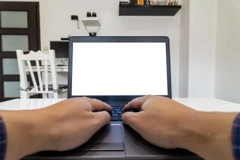 Low angle view of a person working on a laptop from home Stock Photos