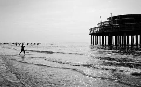 Low angle view on poles of a pier in the sea Stock Photos