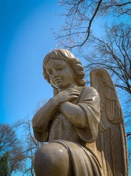Low angle view of praying angel statue Stock Photos