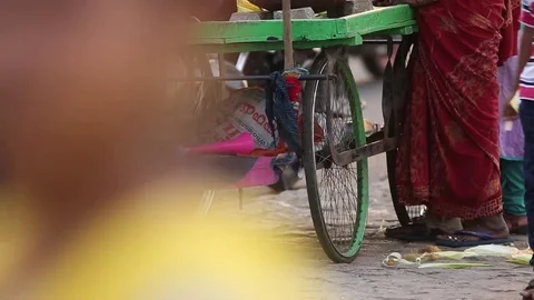 Low angle view of push cart parked on street India Stock Footage 73348077