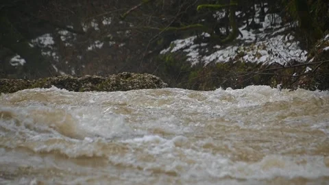 Low angle view of raging river flowing in Alpine valley Stock Footage 144758272