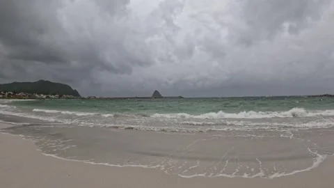 Low angle view of receding ocean wave on white sand at Bleik beach Norway Vidéo 343130576