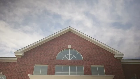 Low angle view of a red brick building facade 스톡 동영상 346298655
