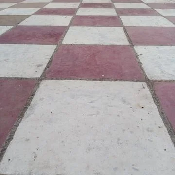 Low angle view red white alternating checkerboard tiled floor 写真素材