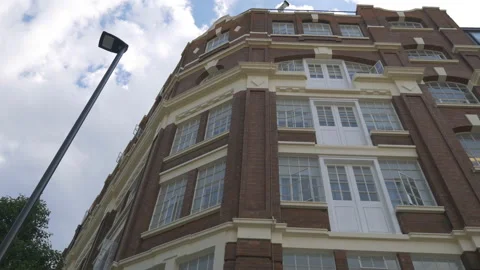 A low angle view of a residential building with massive windows. Stock Footage 111361601