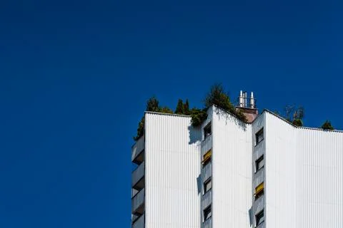 Low angle view of residential building  against blue sky Stock Photos