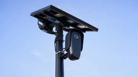 Low Angle View of Roadside Camera and Solar Panel Against Blue Sky Stock-Footage 346406658
