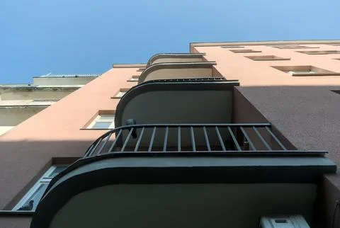 Low-angle view of rounded balconies on a modernist building, Gdynia. Stock Photos