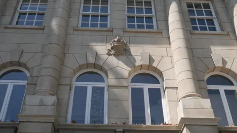 A low angle view of rows of windows on an old building. Stock Footage 125697539