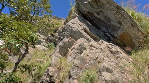 Low Angle View Of Rugged Overhanging Rock Formation At Chauli Ki Jali Mukte.. Video stock 338227360