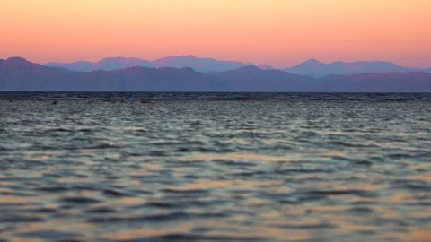 Low angle view from the sea to the mountain range on the opposite shore at Stock-Footage 253209842