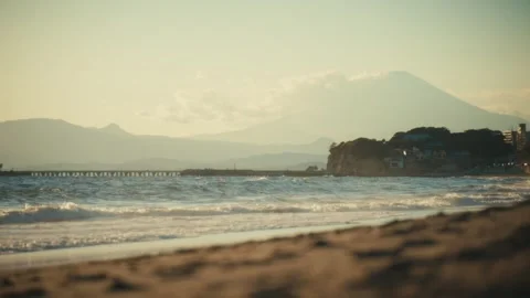 Low-Angle View of Shichirigahama Beach with Enoshima and Mount Fuji, Japan Stock Footage 344037440