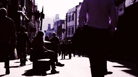 Low angle view of shoppers walking through busy uk commercial area Vídeo Stock 32963166