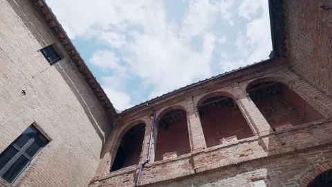 Low angle view shot of an old medieval castle with high brick walls, arched Stock Footage 344656051