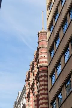 Low-angle view showcasing historical brick architecture with striped patter.. Stock Photos