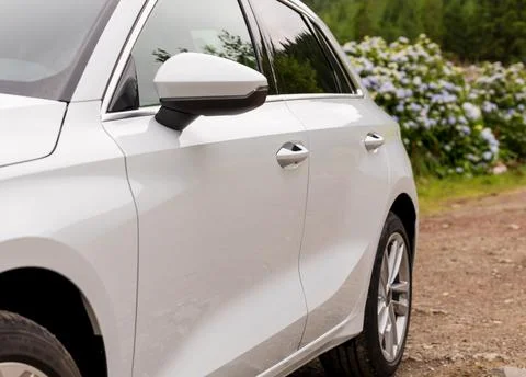 Low angle view of side back rear part of modern white new car. Stock Photos