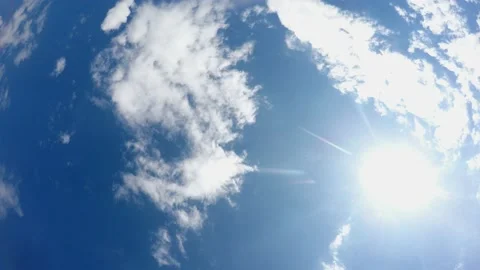 Low angle view of skies with white clouds. View from ground. Camera goes round 스톡 동영상 138629222