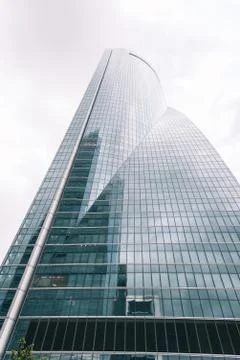 Low angle view of  skyscraper in business district against sky Stock Photos