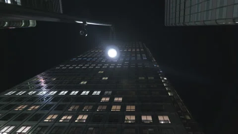 A low angle view of a skyscraper at night. Stock Footage 230304307