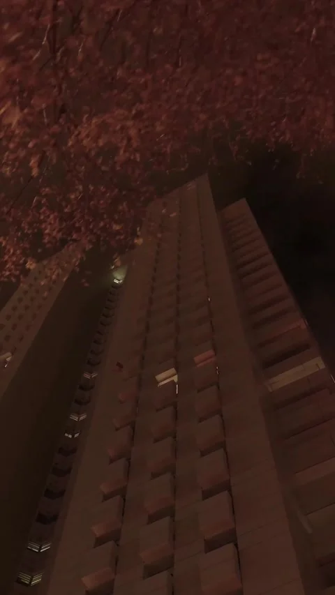 Low angle view of a skyscraper at night Stock Footage 327115389