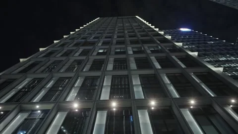 Low angle view of skyscrapers in city at night Video stock 240169294