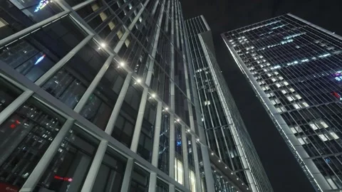 Low angle view of skyscrapers in city at night Video stock 240169487