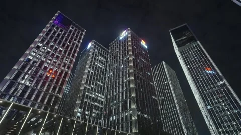 Low angle view of skyscrapers in city at night Video stock 240170175