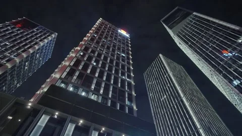 Low angle view of skyscrapers in city at night Video stock 240171024