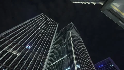 Low angle view of skyscrapers in city at night Video stock 240171193