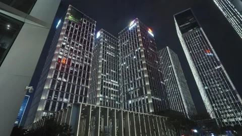 Low angle view of skyscrapers in city at night Video stock 240175708