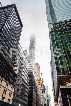 Low angle view of skyscrapers a misty day Stock Photos