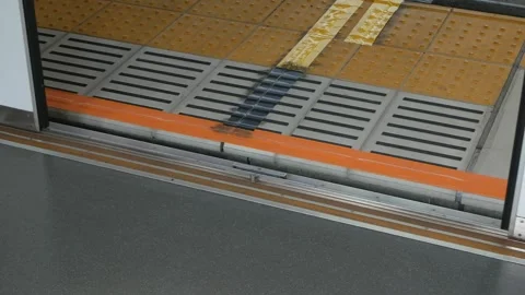 Low angle view to skytrain subway door from inside the train commuter while.. 動画素材 303646393