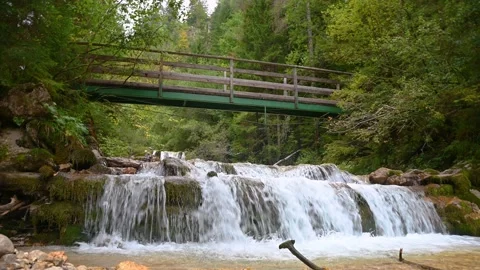 Low angle view of small bridge over Martuljek river in Slovenia Stock Footage 164612794