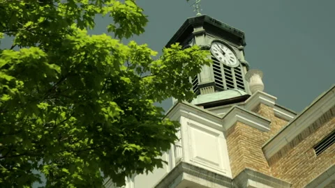 Low angle view of a small town clock tower Stock Footage 236708005